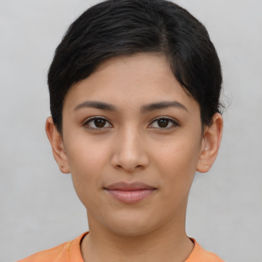 Joyful asian young-adult female with short  brown hair and brown eyes