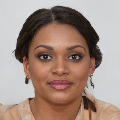 Joyful black young-adult female with medium  brown hair and brown eyes