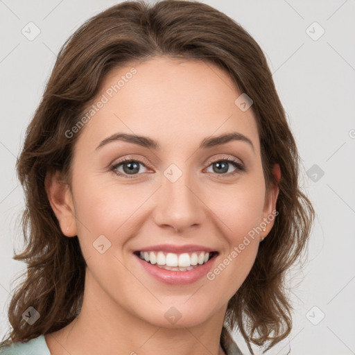 Joyful white young-adult female with medium  brown hair and green eyes