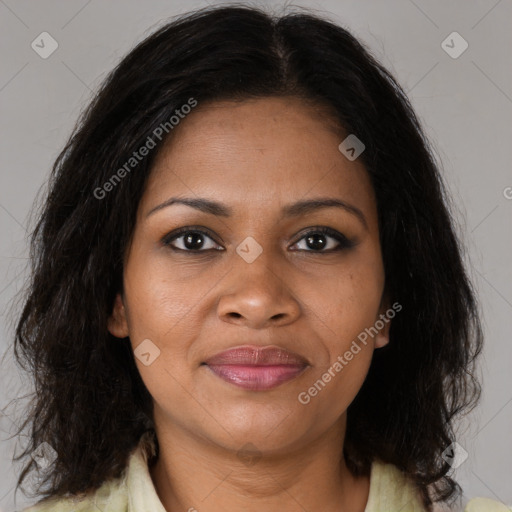 Joyful black adult female with medium  brown hair and brown eyes