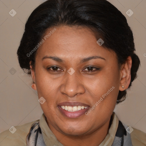 Joyful latino adult female with medium  brown hair and brown eyes