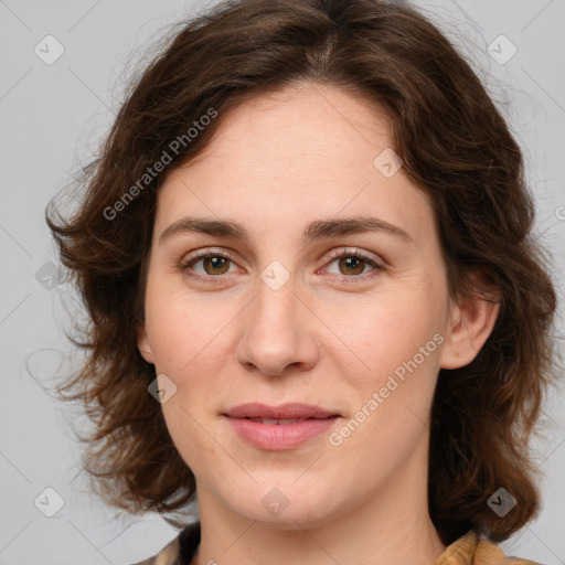 Joyful white young-adult female with medium  brown hair and green eyes