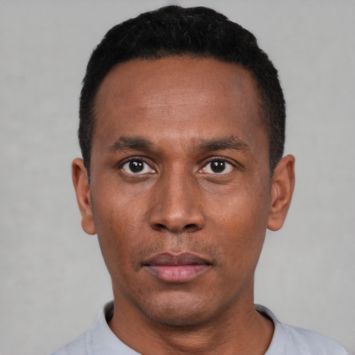 Neutral black adult male with short  black hair and brown eyes
