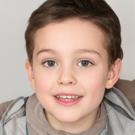 Joyful white child female with short  brown hair and brown eyes