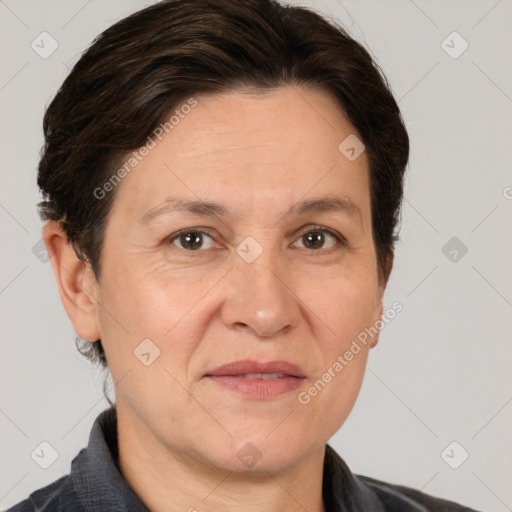 Joyful white adult female with short  brown hair and brown eyes