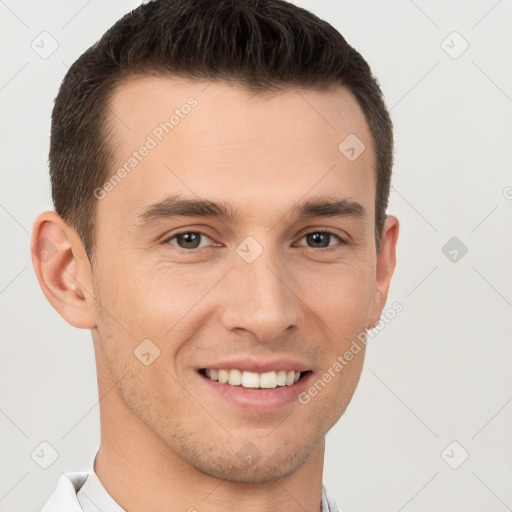 Joyful white young-adult male with short  brown hair and brown eyes