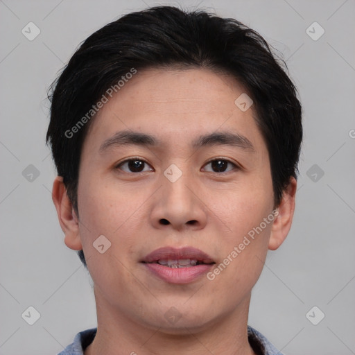 Joyful asian young-adult male with short  black hair and brown eyes