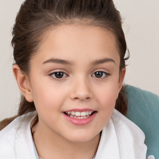 Joyful white child female with short  brown hair and brown eyes