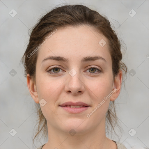 Joyful white young-adult female with medium  brown hair and green eyes