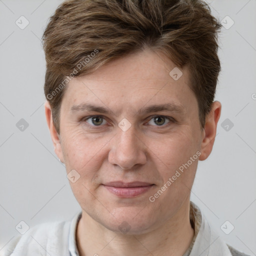 Joyful white adult male with short  brown hair and grey eyes