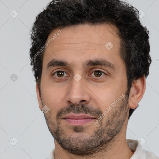 Joyful white adult male with short  brown hair and brown eyes