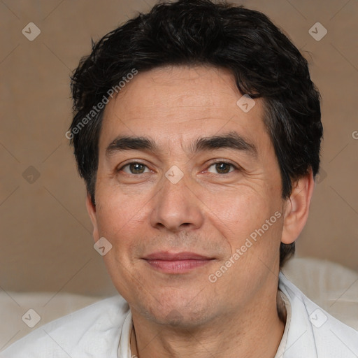 Joyful white adult male with short  black hair and brown eyes