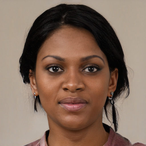 Joyful black young-adult female with medium  black hair and brown eyes