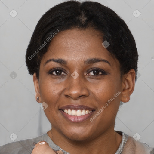 Joyful latino young-adult female with short  black hair and brown eyes