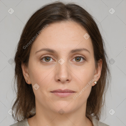 Joyful white young-adult female with medium  brown hair and green eyes