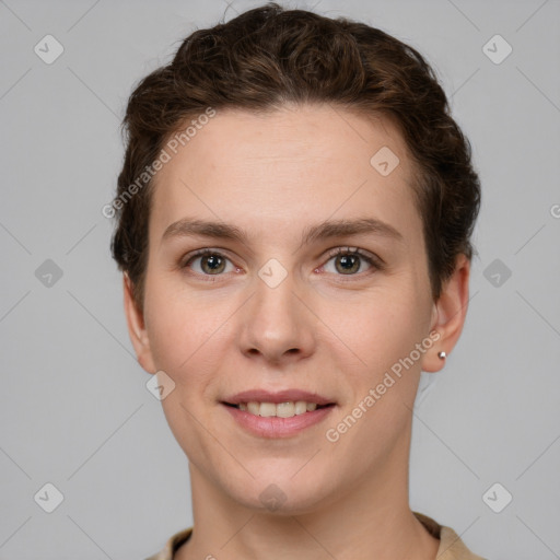 Joyful white young-adult female with short  brown hair and grey eyes