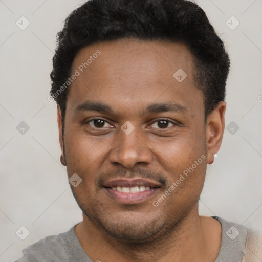 Joyful latino young-adult male with short  brown hair and brown eyes