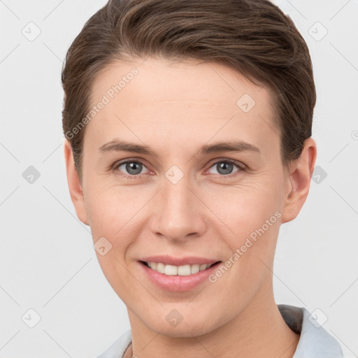 Joyful white young-adult female with short  brown hair and grey eyes