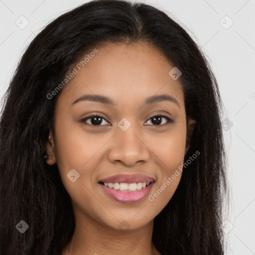 Joyful latino young-adult female with long  brown hair and brown eyes