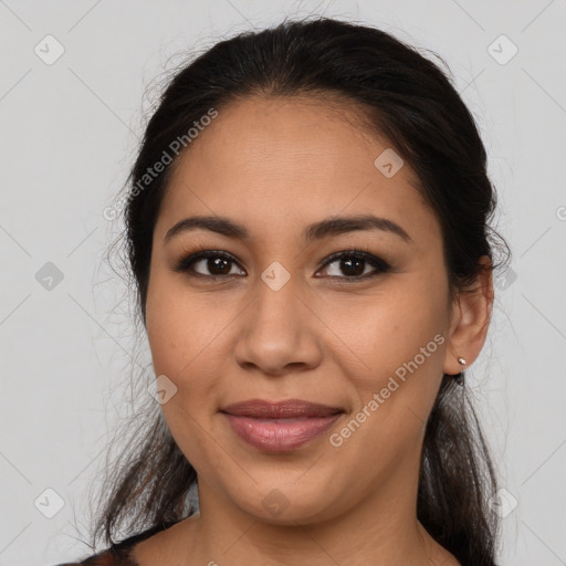 Joyful latino young-adult female with medium  brown hair and brown eyes