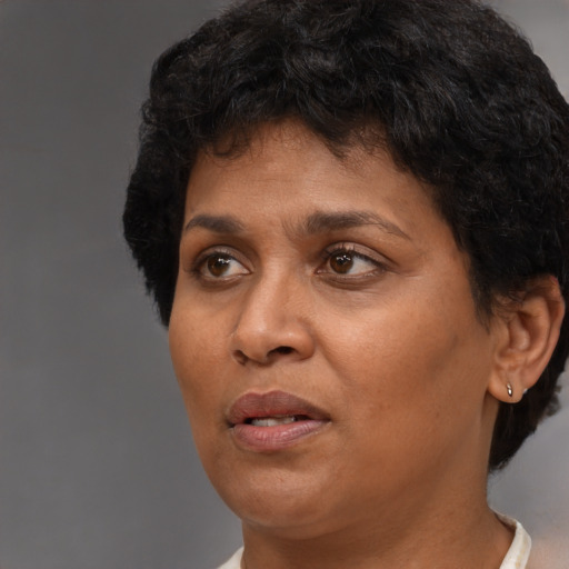 Neutral black adult female with short  brown hair and brown eyes