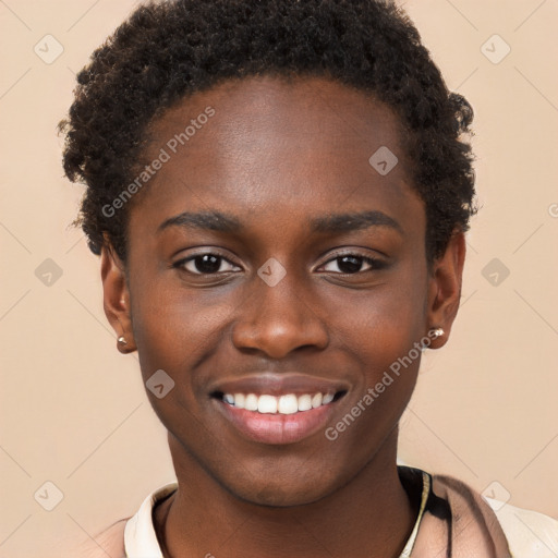 Joyful black young-adult male with short  brown hair and brown eyes