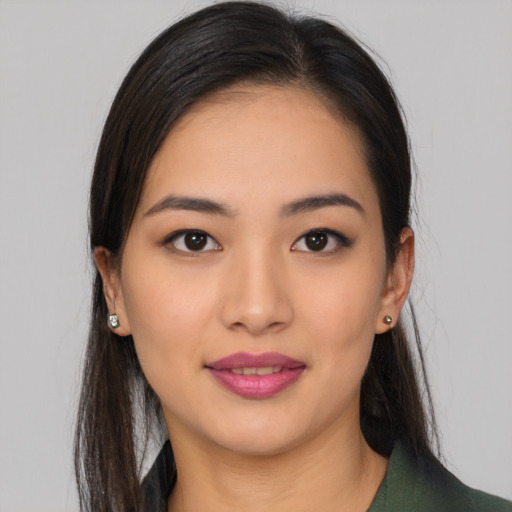 Joyful white young-adult female with long  black hair and brown eyes