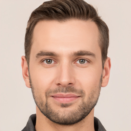 Joyful white young-adult male with short  brown hair and brown eyes