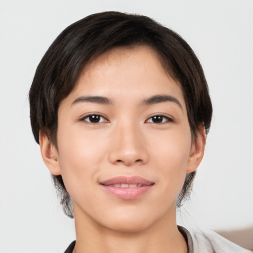 Joyful asian young-adult female with short  black hair and brown eyes