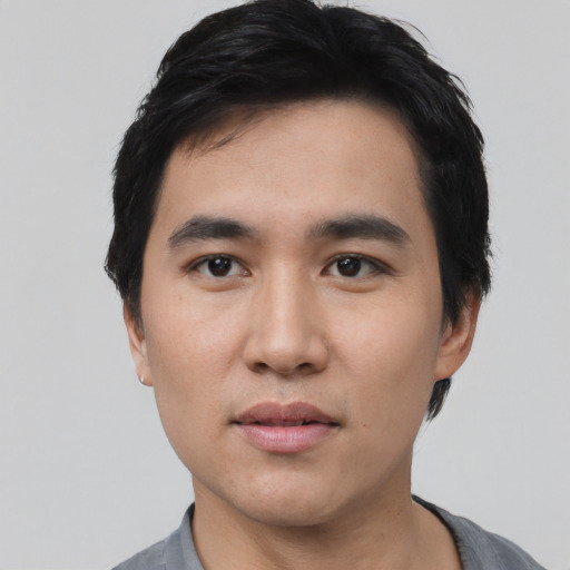 Neutral asian young-adult male with short  black hair and brown eyes