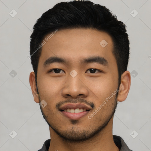 Joyful asian young-adult male with short  black hair and brown eyes