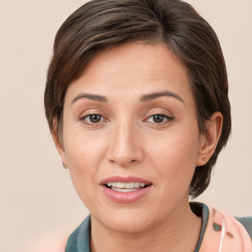 Joyful white young-adult female with short  brown hair and brown eyes