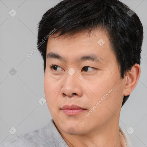 Neutral asian young-adult male with short  black hair and brown eyes