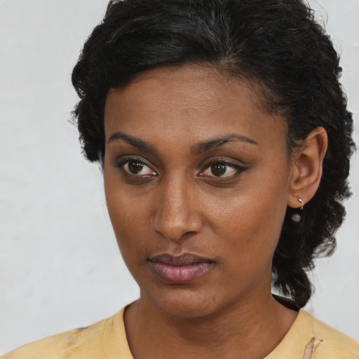 Neutral latino young-adult female with short  brown hair and brown eyes