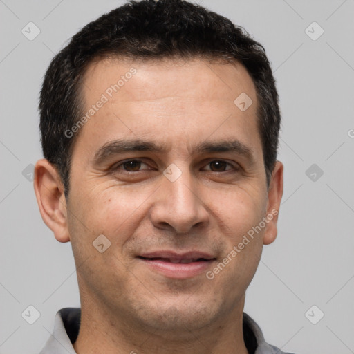 Joyful white adult male with short  brown hair and brown eyes