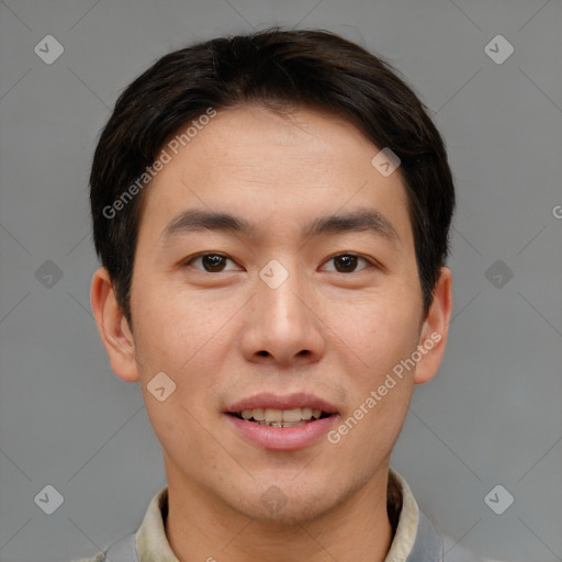 Joyful asian young-adult male with short  brown hair and brown eyes