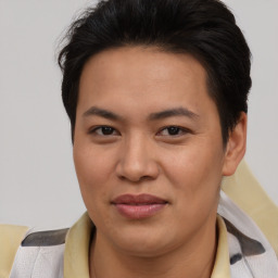Joyful asian young-adult female with short  brown hair and brown eyes