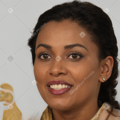 Joyful black young-adult female with long  brown hair and brown eyes