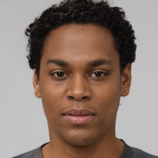 Neutral black young-adult male with short  black hair and brown eyes