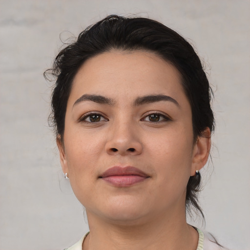 Joyful asian young-adult female with medium  brown hair and brown eyes