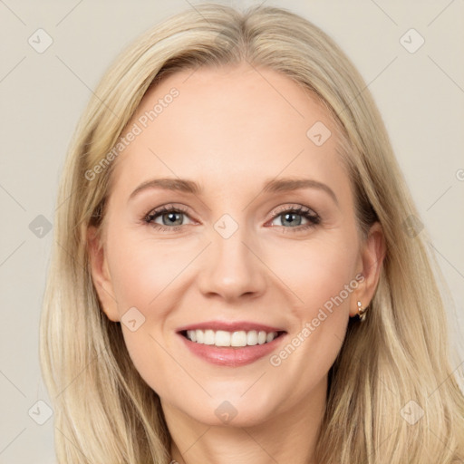 Joyful white young-adult female with long  brown hair and blue eyes