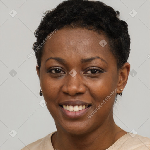 Joyful black young-adult female with short  black hair and brown eyes