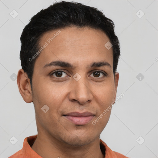 Joyful latino young-adult male with short  brown hair and brown eyes