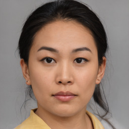 Neutral asian young-adult female with medium  brown hair and brown eyes