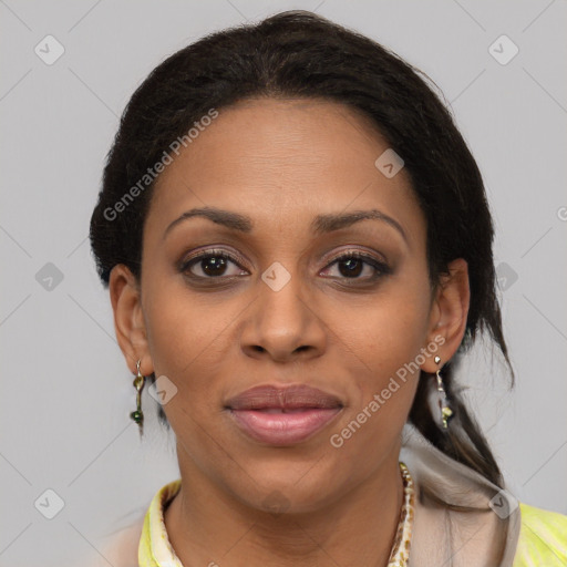 Joyful black adult female with medium  brown hair and brown eyes