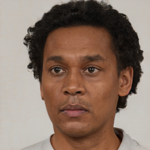 Neutral black adult male with short  brown hair and brown eyes
