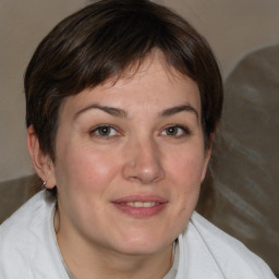 Joyful white adult female with medium  brown hair and brown eyes