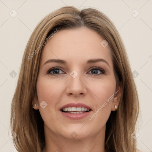 Joyful white young-adult female with long  brown hair and brown eyes