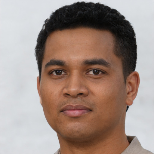 Neutral latino young-adult male with short  black hair and brown eyes