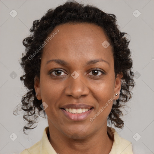 Joyful black adult female with medium  brown hair and brown eyes